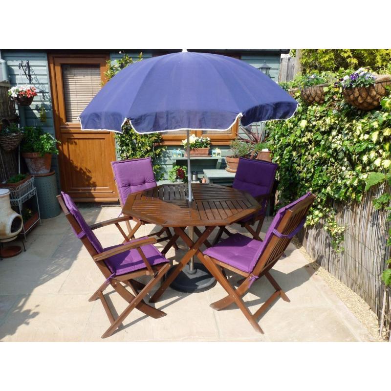 Patio table and 4 chairs with parasol