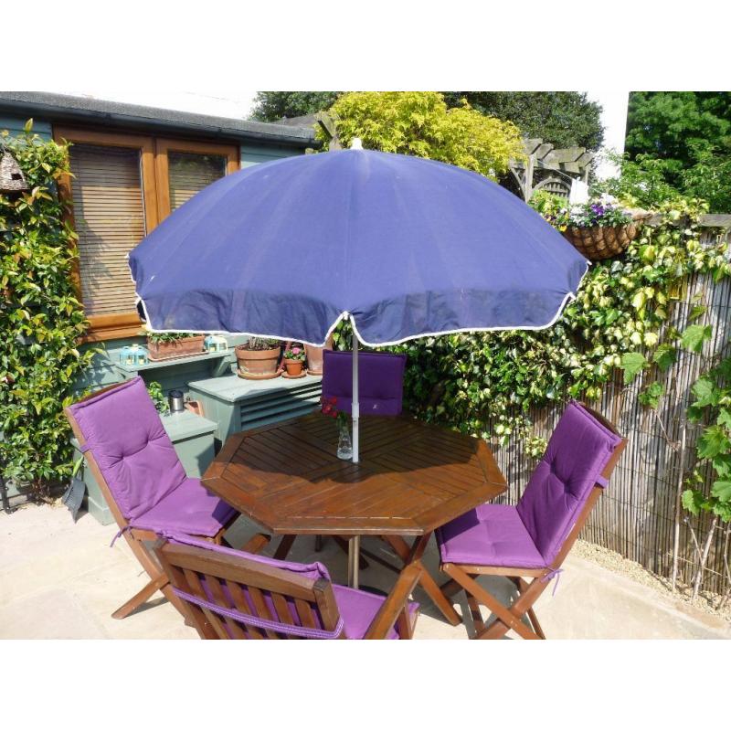 Patio table and 4 chairs with parasol
