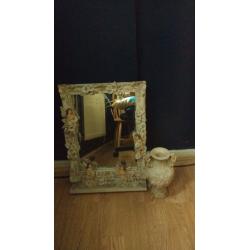 Antique mirror with vase