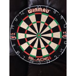 Winmau blade 4 dart board and cupboard with some darts and accessories