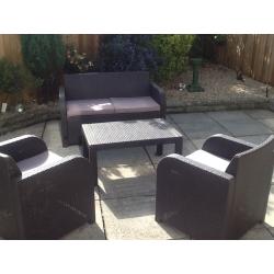 Rattan brown furniture with dark beige cusions