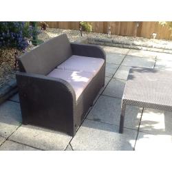 Rattan brown furniture with dark beige cusions