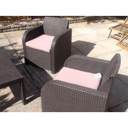 Rattan brown furniture with dark beige cusions