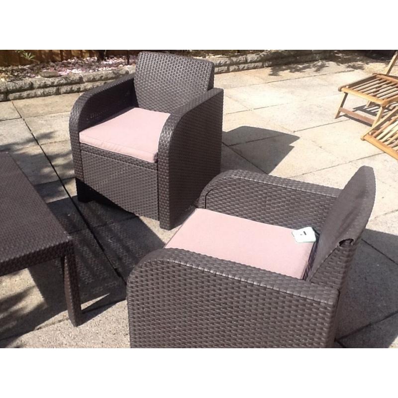 Rattan brown furniture with dark beige cusions