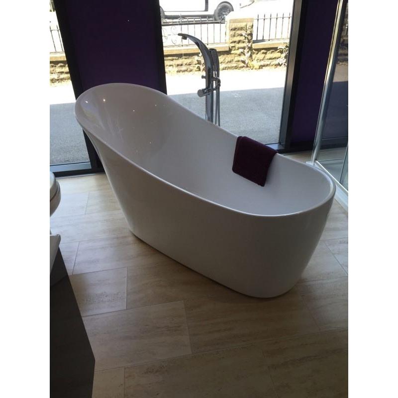 Free standing designer bath with free standing tap