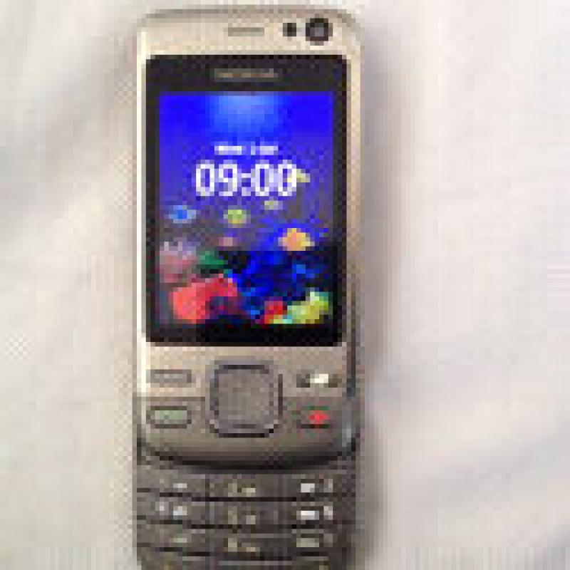 Nokia 6600i open to all network Slide mobile phone, in good condition, stainless steel silver body