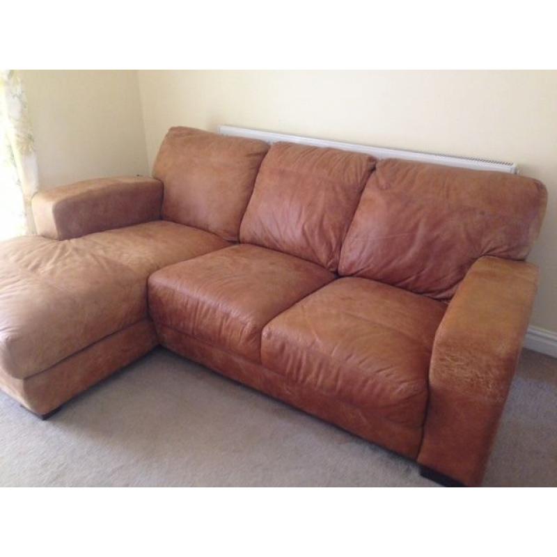 Antique tan leather corner sofa, less than 12 months old. Excellent condition.