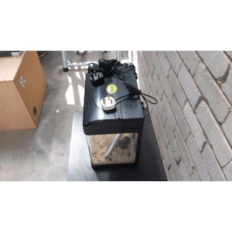 Small tank with built in lights and filter. Heater included.