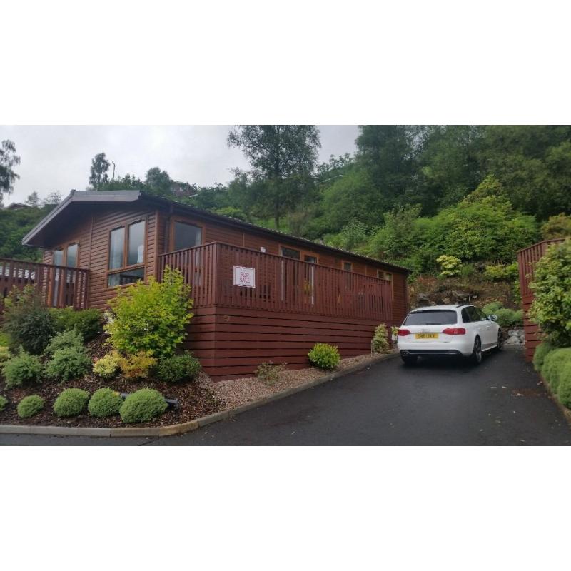 Two bedroom luxury lodge for sale on Drimsynie Estate, Lochgoilhead with annual fee paid.