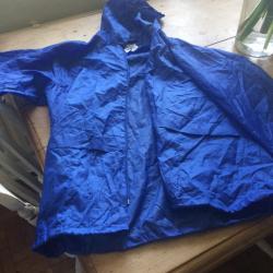 Kids blue waterproof jacket in a bag