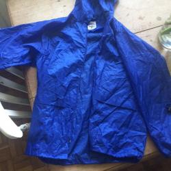 Kids blue waterproof jacket in a bag