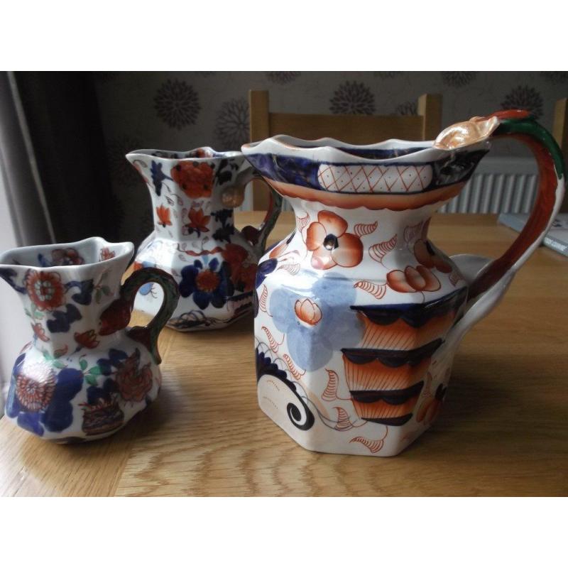 Three old graduated masons ironstone octagonal jugs.