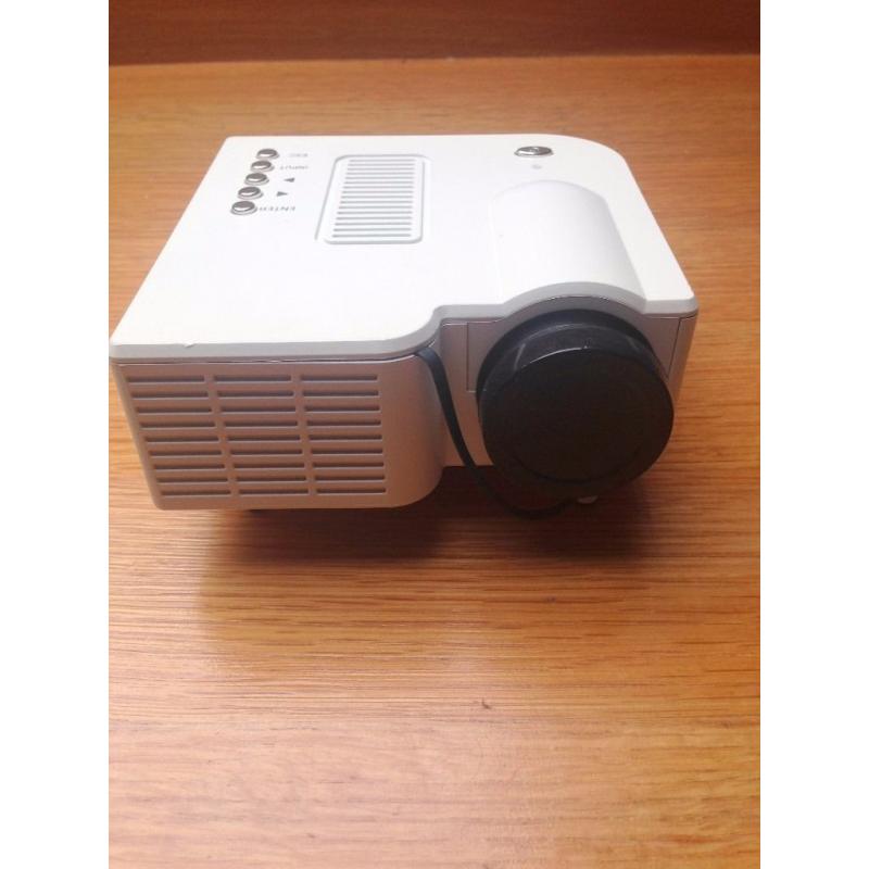 Mini portable projector; comp' with HDMI, AV, SCAR, VGA, USB and SD card Built in speakers