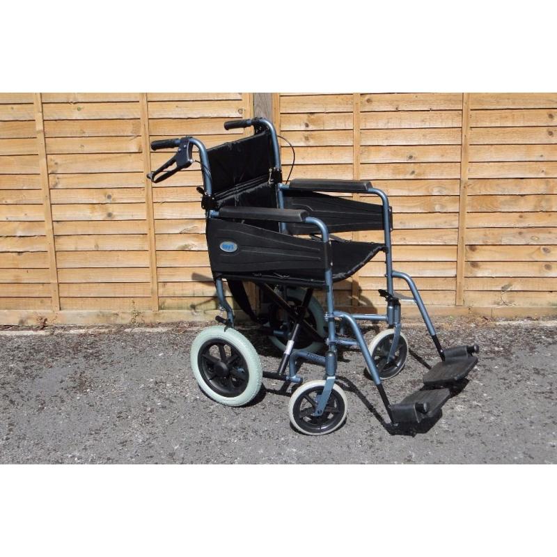 Wheelchair with foldaway footrests & locking brakes