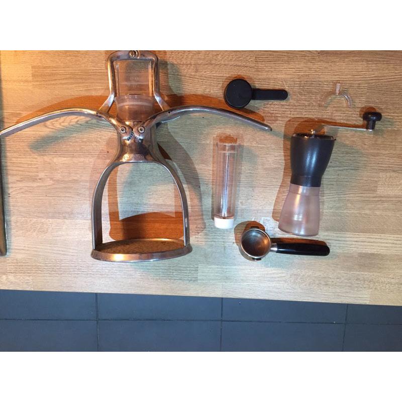 Presso hand pressed espresso maker with coffee grinder
