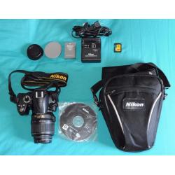 Nikon D3000 DSLR with 18-55mm Nikkor lens and accessories