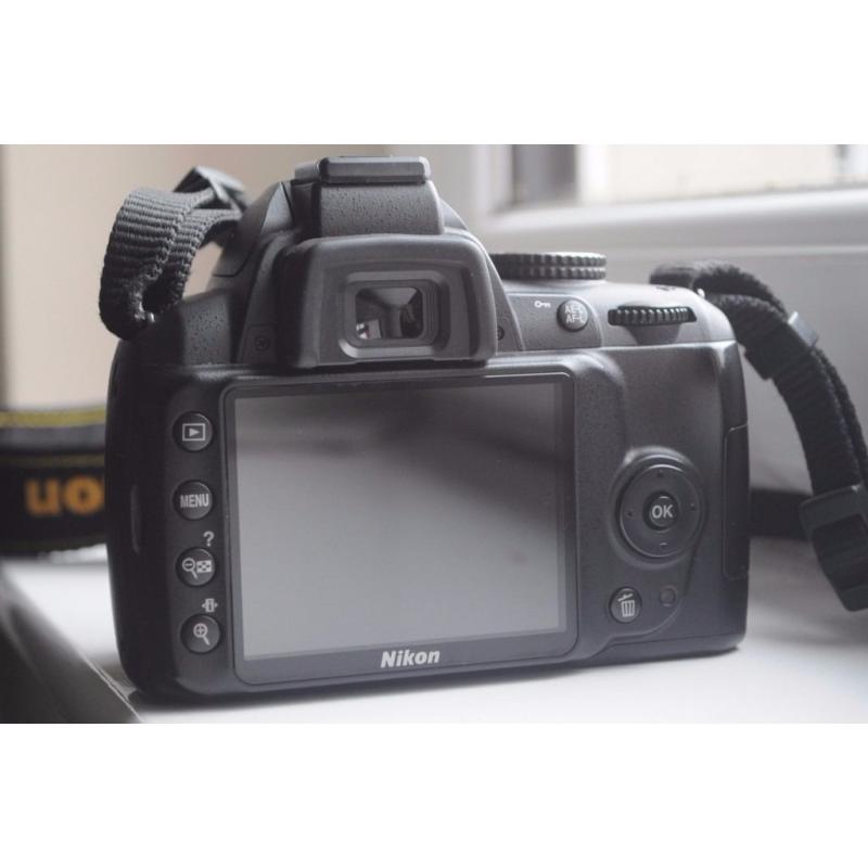 Nikon D3000 DSLR with 18-55mm Nikkor lens and accessories