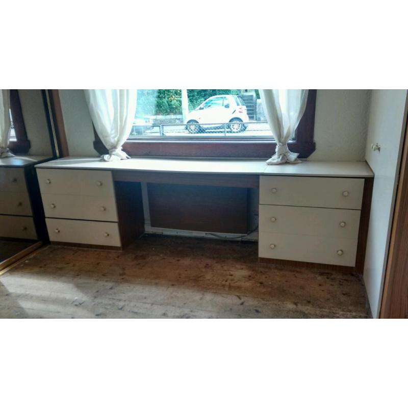 Free built in bedroom storage with large tinted mirrors