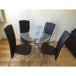 Stylish glass table with chrome legs :