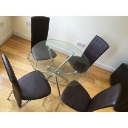 Stylish glass table with chrome legs :