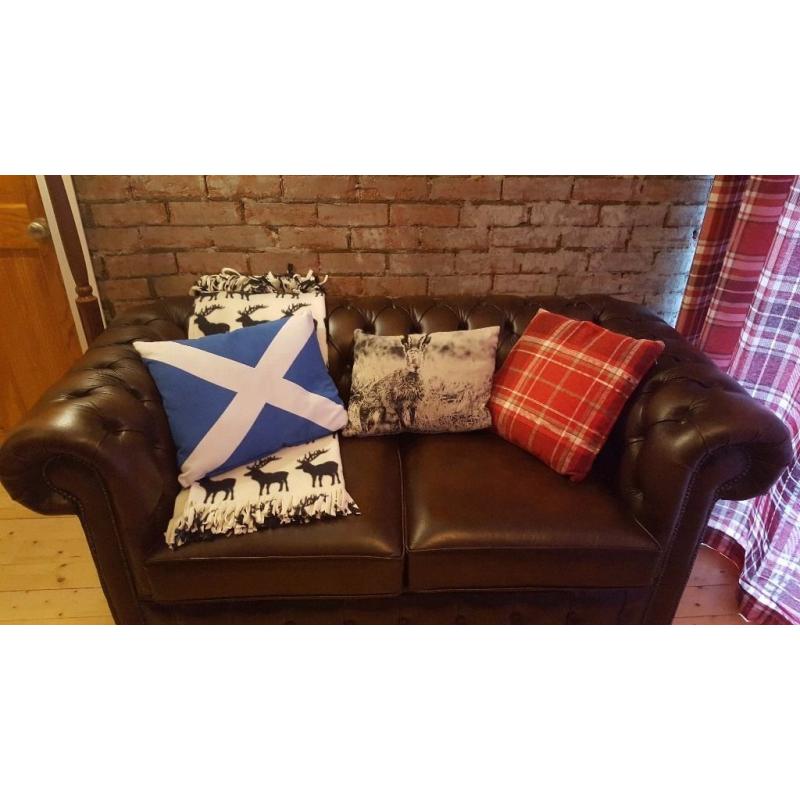 Beautiful brown leather chesterfield sofa bed.