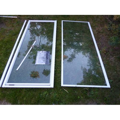Plain glass hinged shower door with glass side panel + extra side panel, unused.