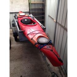Sea kayak with stabilisers