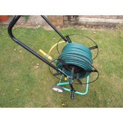 Garden hose on a trolley