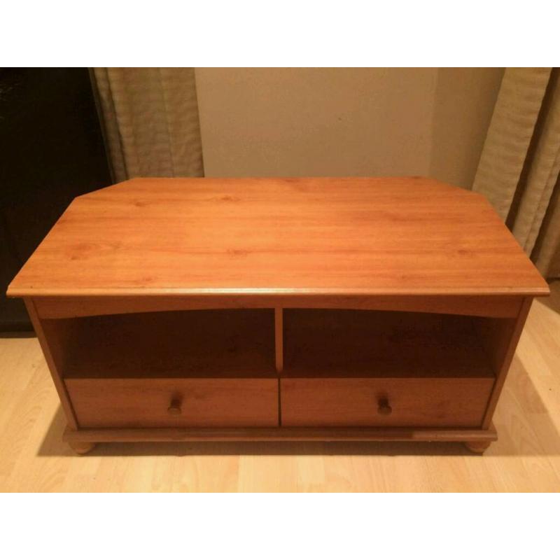Wooden TV stand with two drawers.