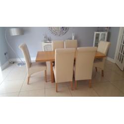 Dining table and 6 cream chairs