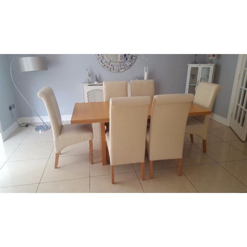 Dining table and 6 cream chairs