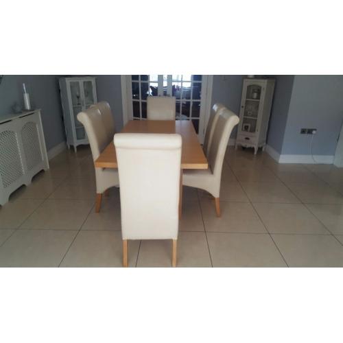 Dining table and 6 cream chairs