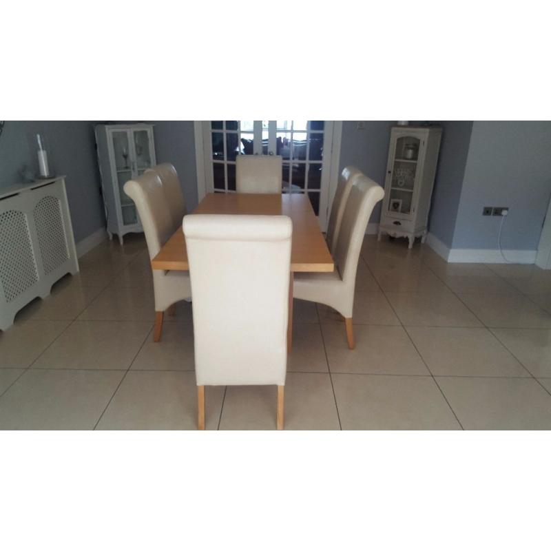 Dining table and 6 cream chairs