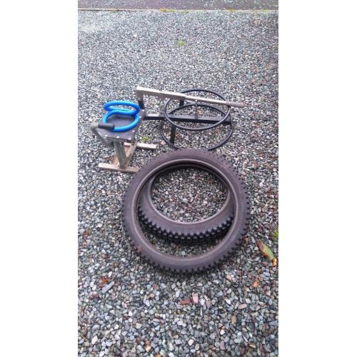 Dirt bike tyre changing frame, stand and used trials two tyres