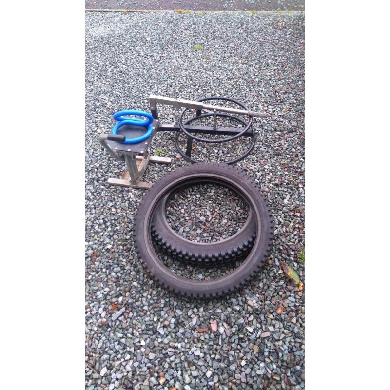 Dirt bike tyre changing frame, stand and used trials two tyres