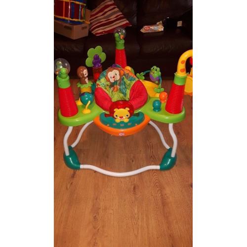 Bright starts activity. Plays tunes and helps baby learn in 3 different languages.