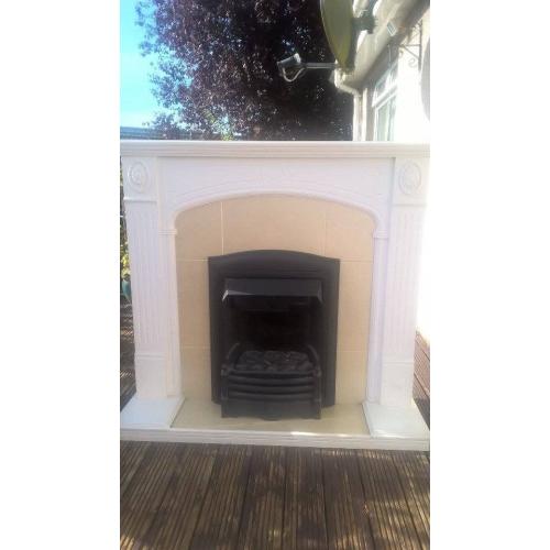 Flame effect electric fire and mantelpiece surround.