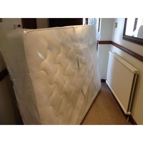 Unused double mattress in packaging