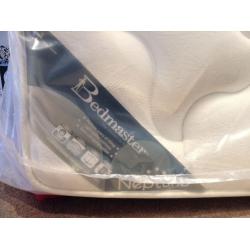 Unused double mattress in packaging