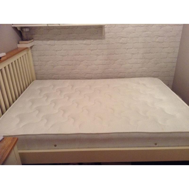 Unused double mattress in packaging