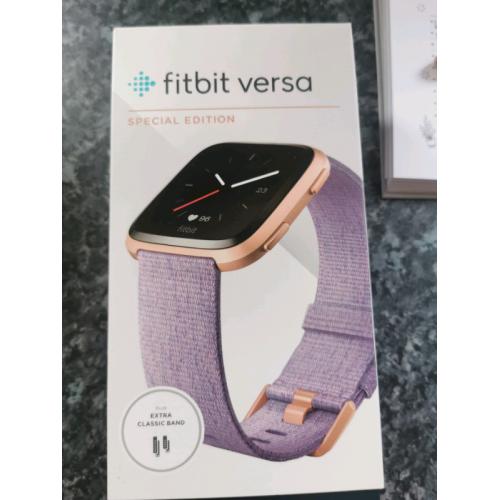 Fitbit versa special edition with charging wire and extra bands