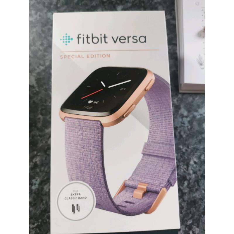 Fitbit versa special edition with charging wire and extra bands