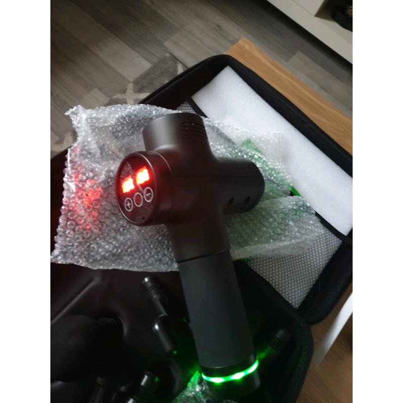 ** BRAND NEW MASSAGE GUNS**