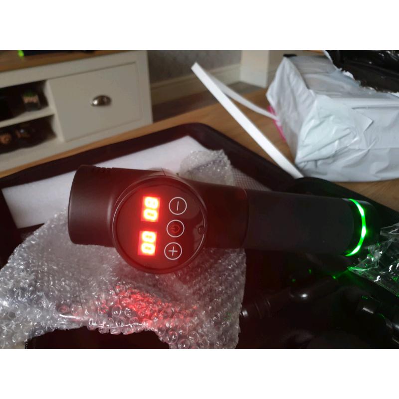 ** BRAND NEW MASSAGE GUNS**