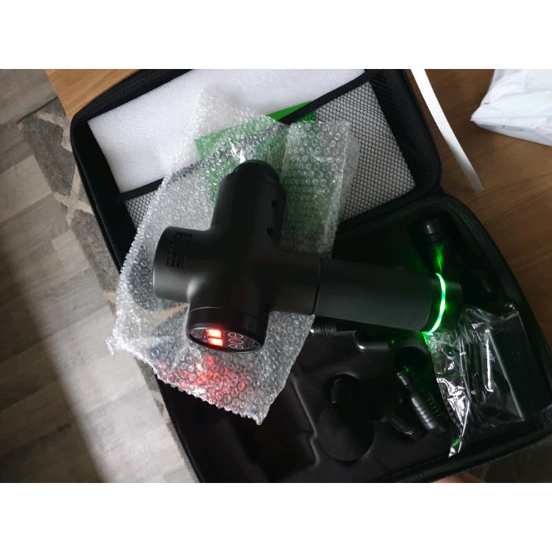 ** BRAND NEW MASSAGE GUNS**