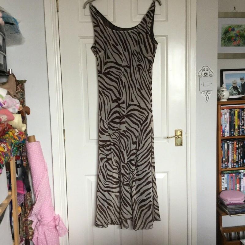 Lovely midi/long length sleeveless dress size 12. Light brown and cream zebra style stripes.