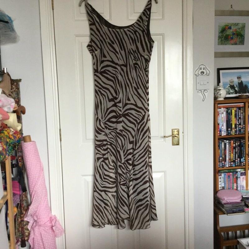 Lovely midi/long length sleeveless dress size 12. Light brown and cream zebra style stripes.