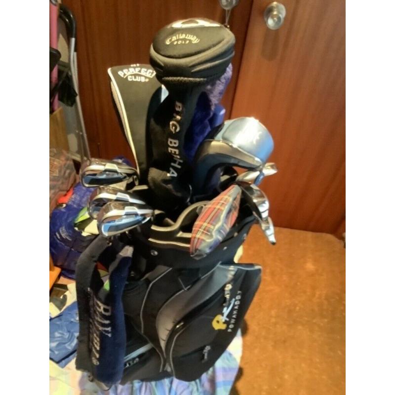 Ladies? golf clubs and trolley.