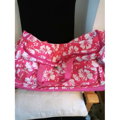 Large pink roller bag