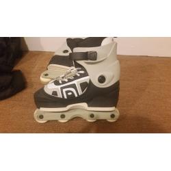 Size 7-Anarchy Combat Roller Blades (with pads and bag)
